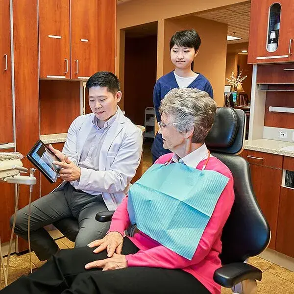 Dr. Hu showing a patient her digital scans