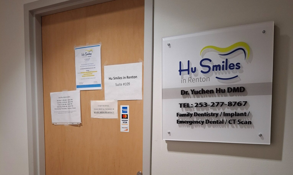 Hu Smiles in Renton dental office entrance door and professional signage for Dr. Yuchen Hu DMD