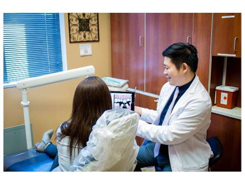 Dr. Yuchen Hu showing a patient digital impressions