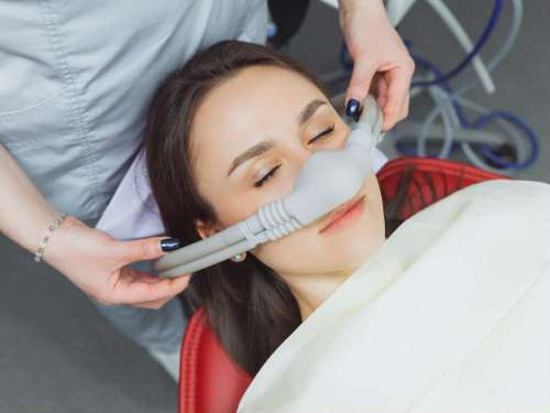 patient getting nitrous oxide during dental treatment