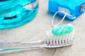 toothbrush with toothpaste floss