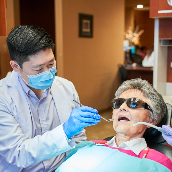 Dr. Hu tends to a patient at Hu Smiles in Renton, WA